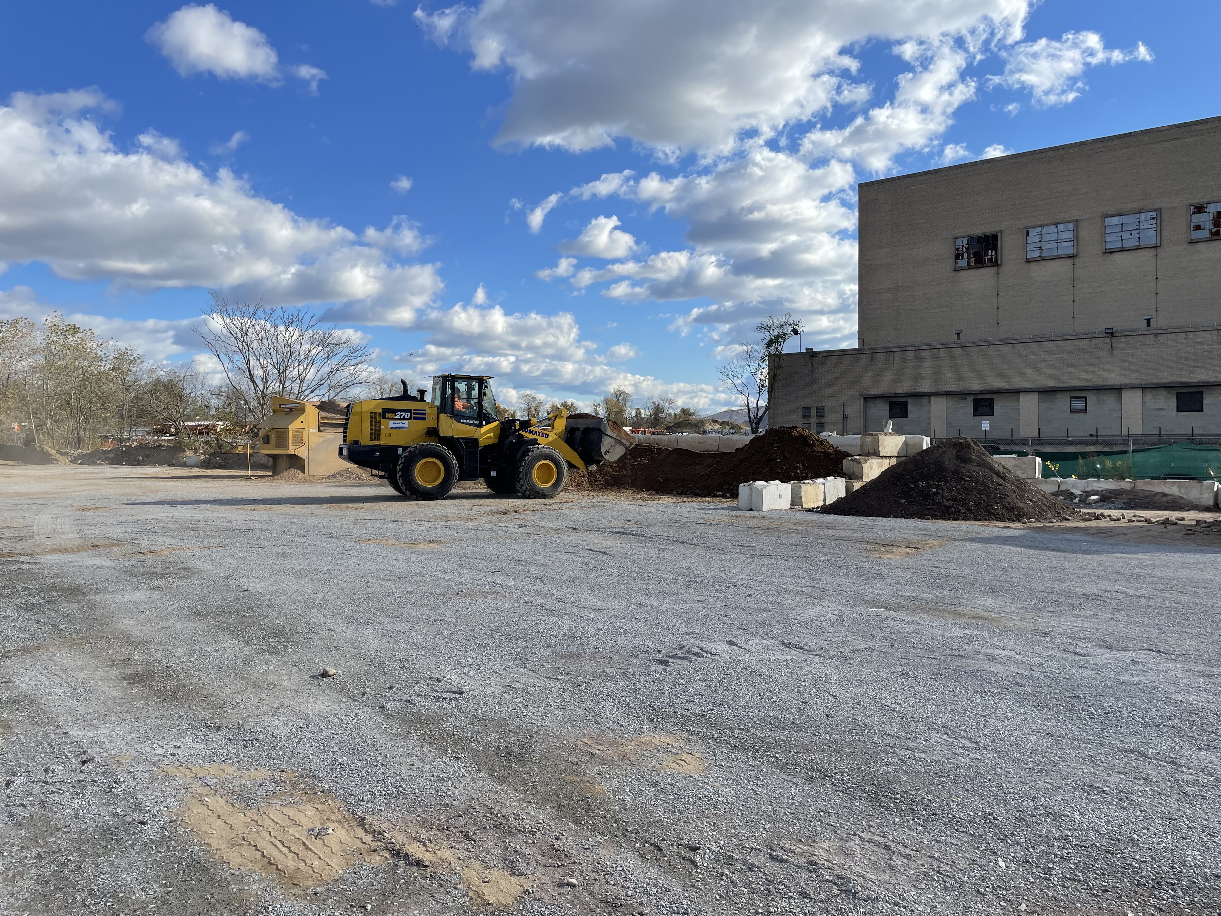 Truck Dumping Soil Onto Pile